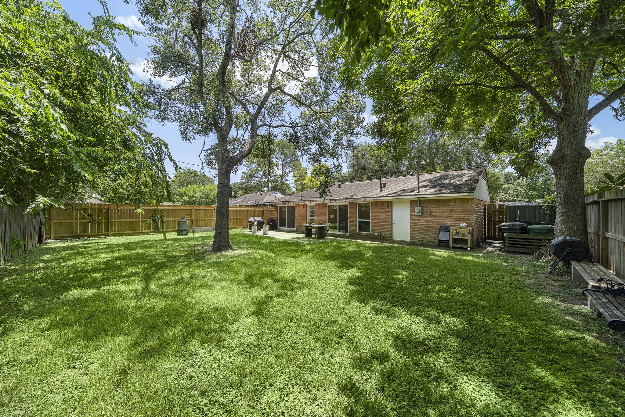 4306 Warm Springs Road Houston, TX 77035 - Photo 32 of 36 Picture from 2023. added Shade cover for patio and tree in middle removed