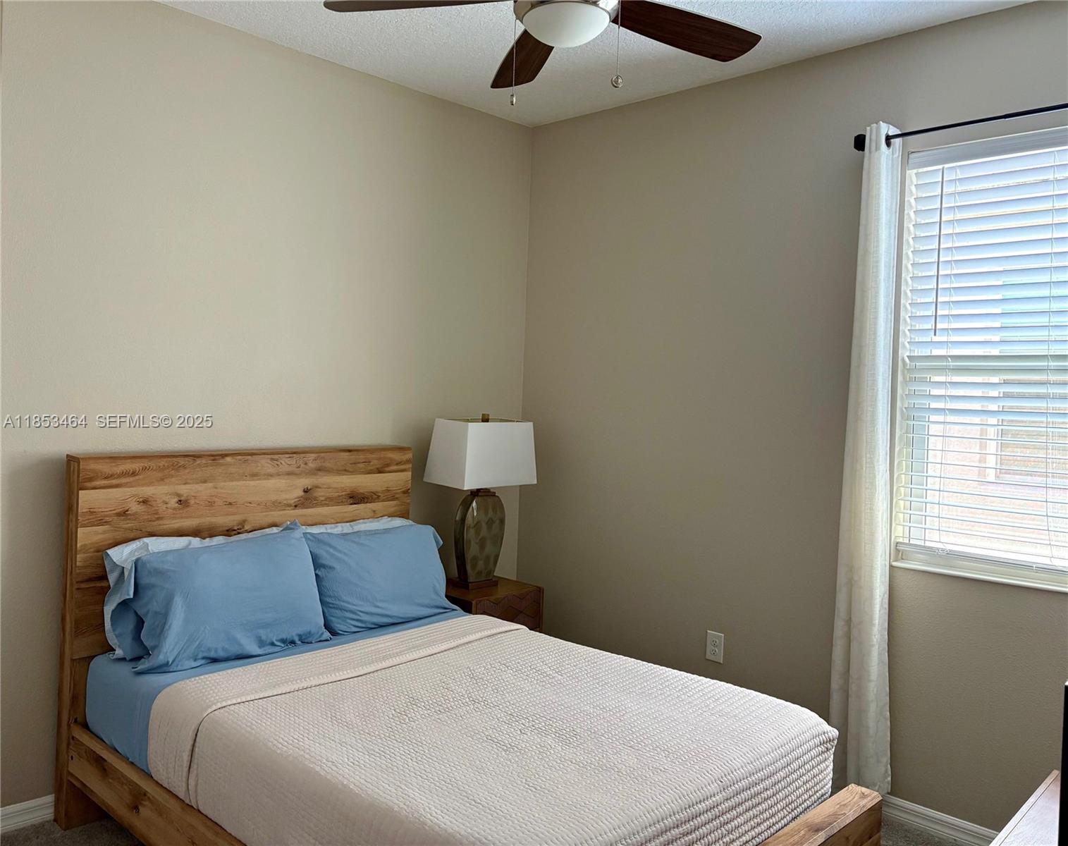 4582 Baler Trails Drive St. Cloud, FL 34772 - Photo 15 of 27 a bedroom with a bed and a chandelier