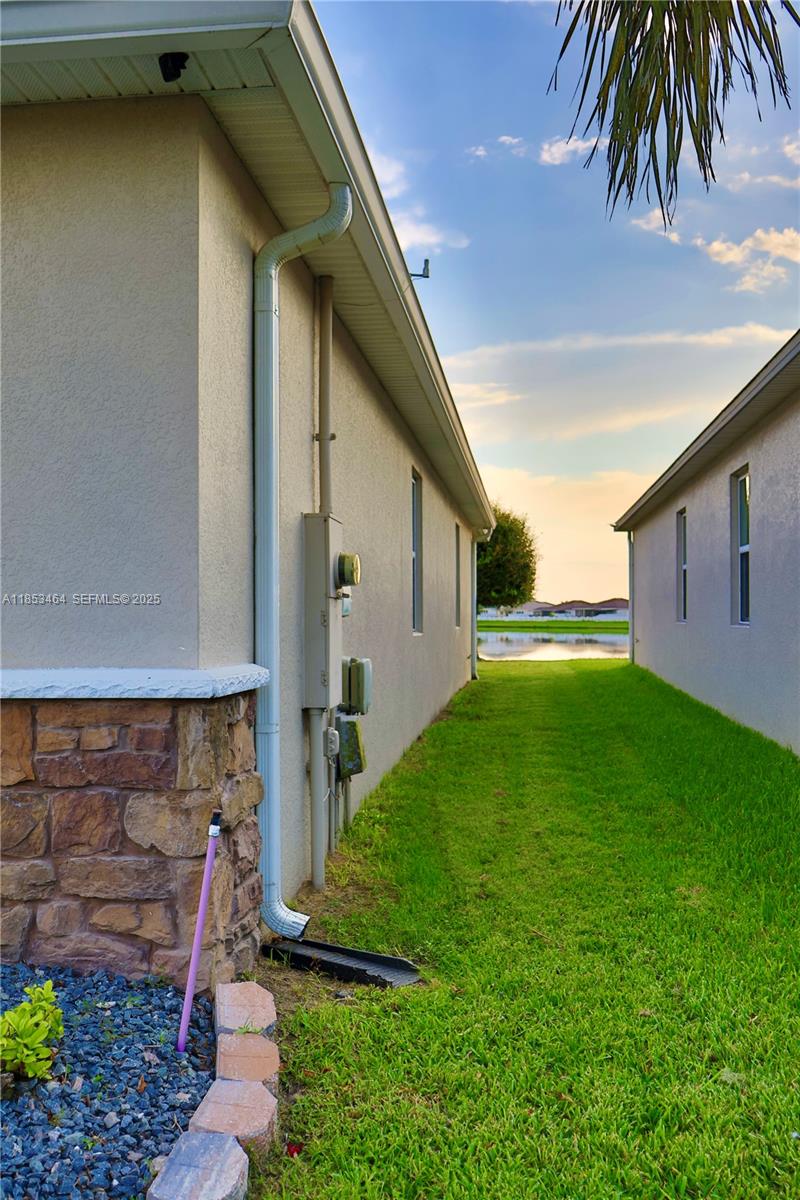 4582 Baler Trails Drive St. Cloud, FL 34772 - Photo 21 of 27 a backyard of a house with seating space