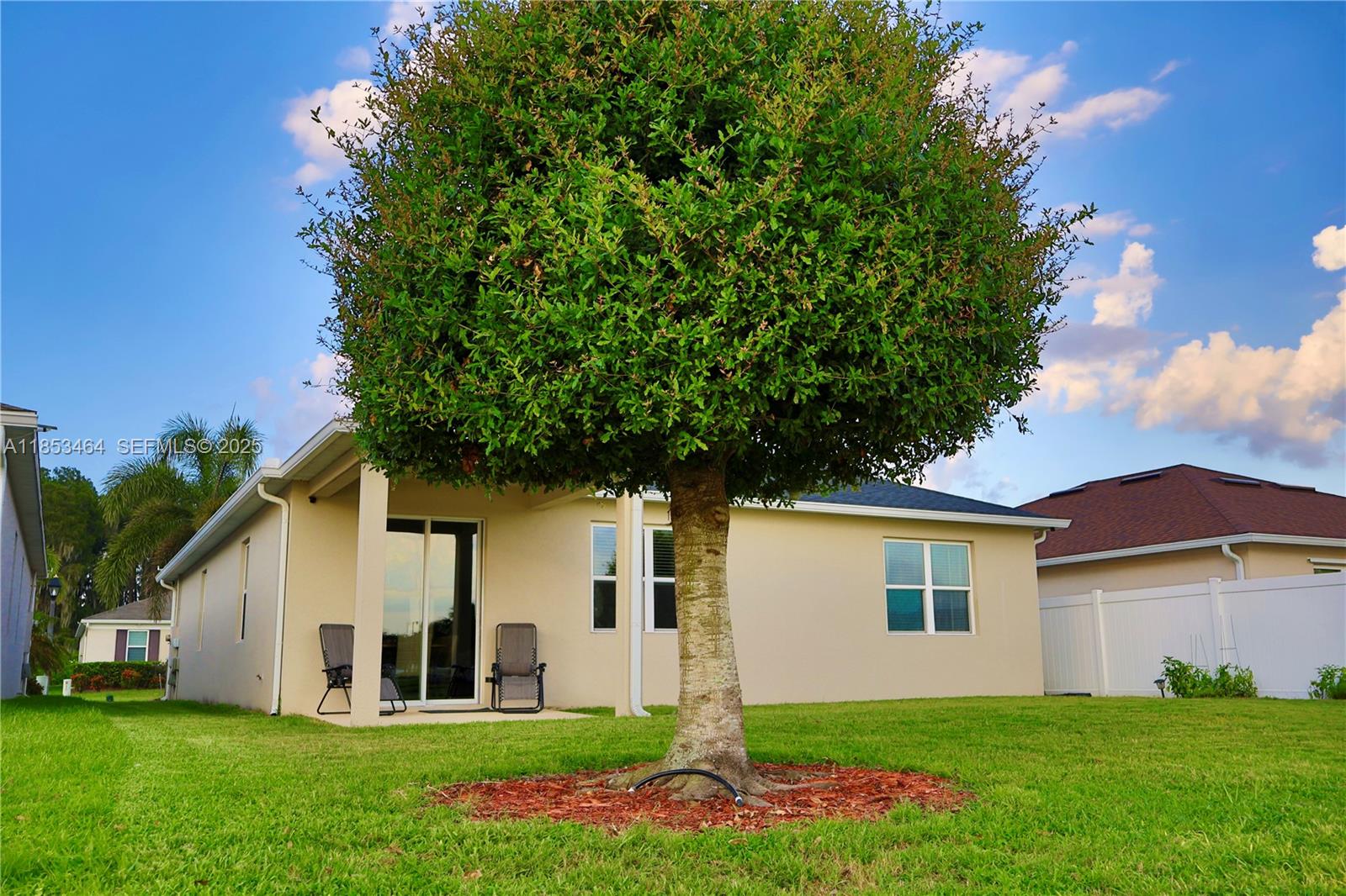4582 Baler Trails Drive St. Cloud, FL 34772 - Photo 23 of 27 a front view of house with yard and green space