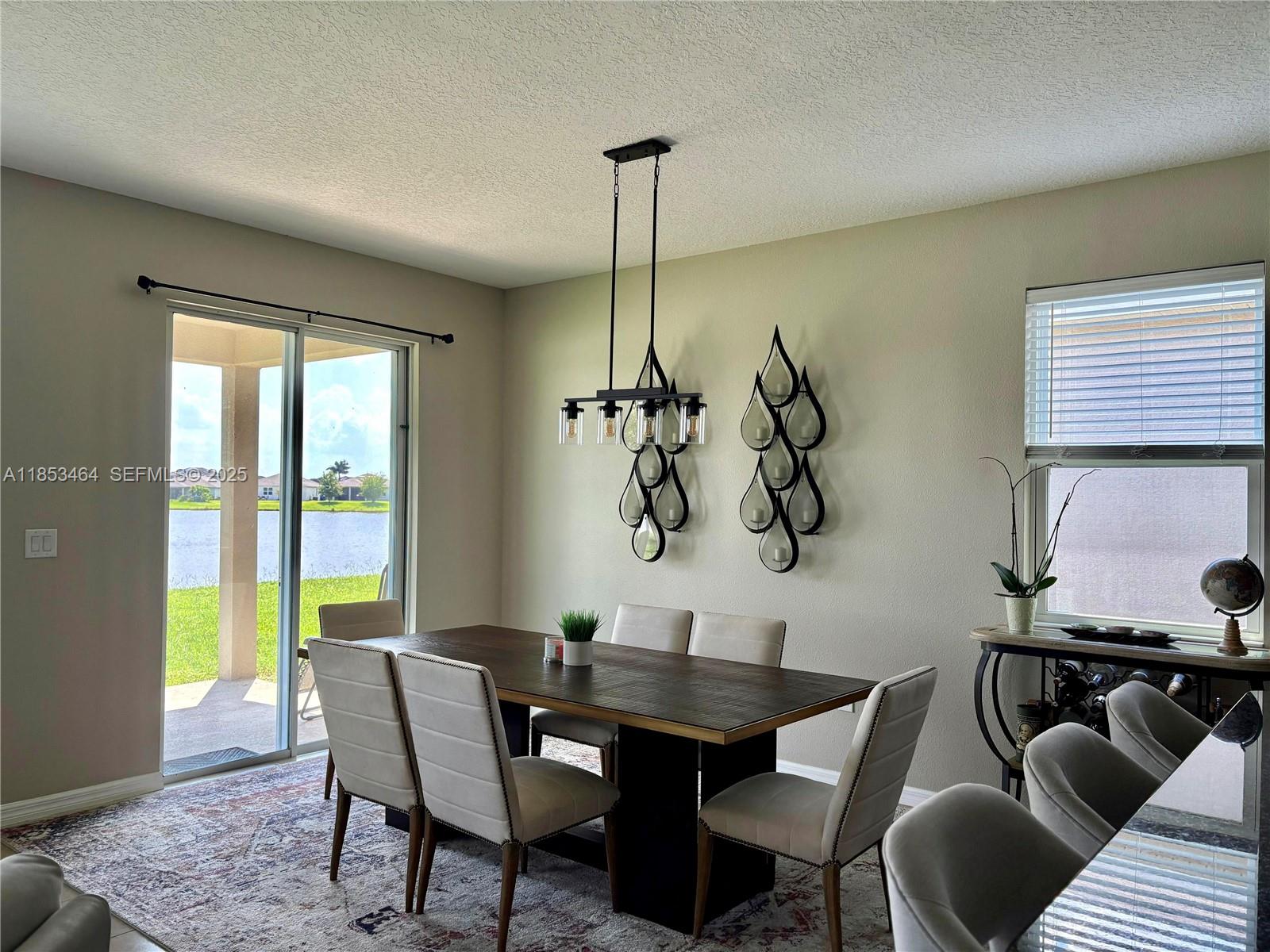 4582 Baler Trails Drive St. Cloud, FL 34772 - Photo 6 of 27 a dining room with furniture and window