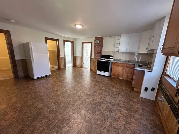 a view of kitchen and wooden floor