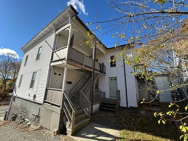 a view of a back yard of the building