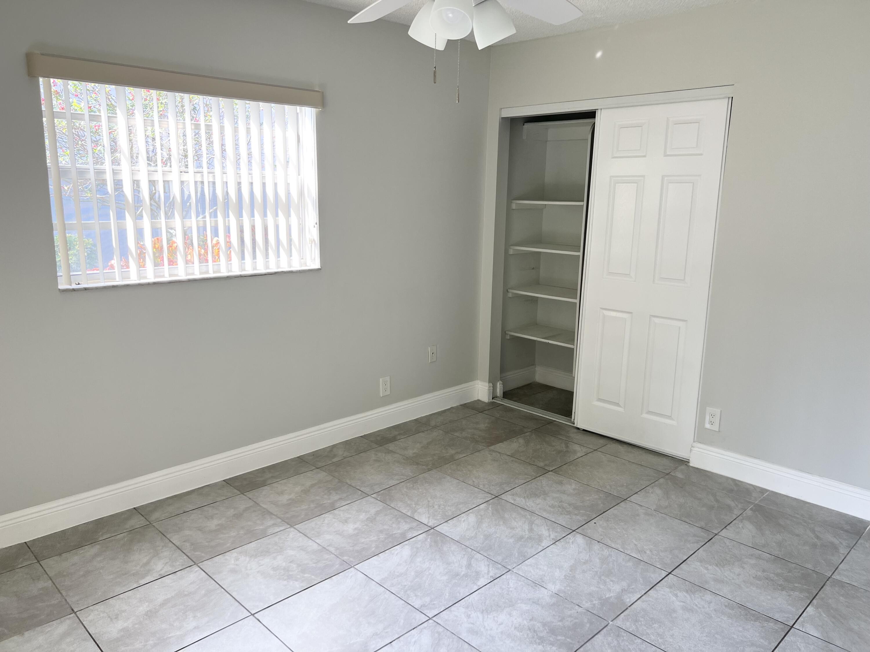 150 Burgandy Way, Unit D Delray Beach, FL 33484 - Photo 11 of 33 an empty room with a window