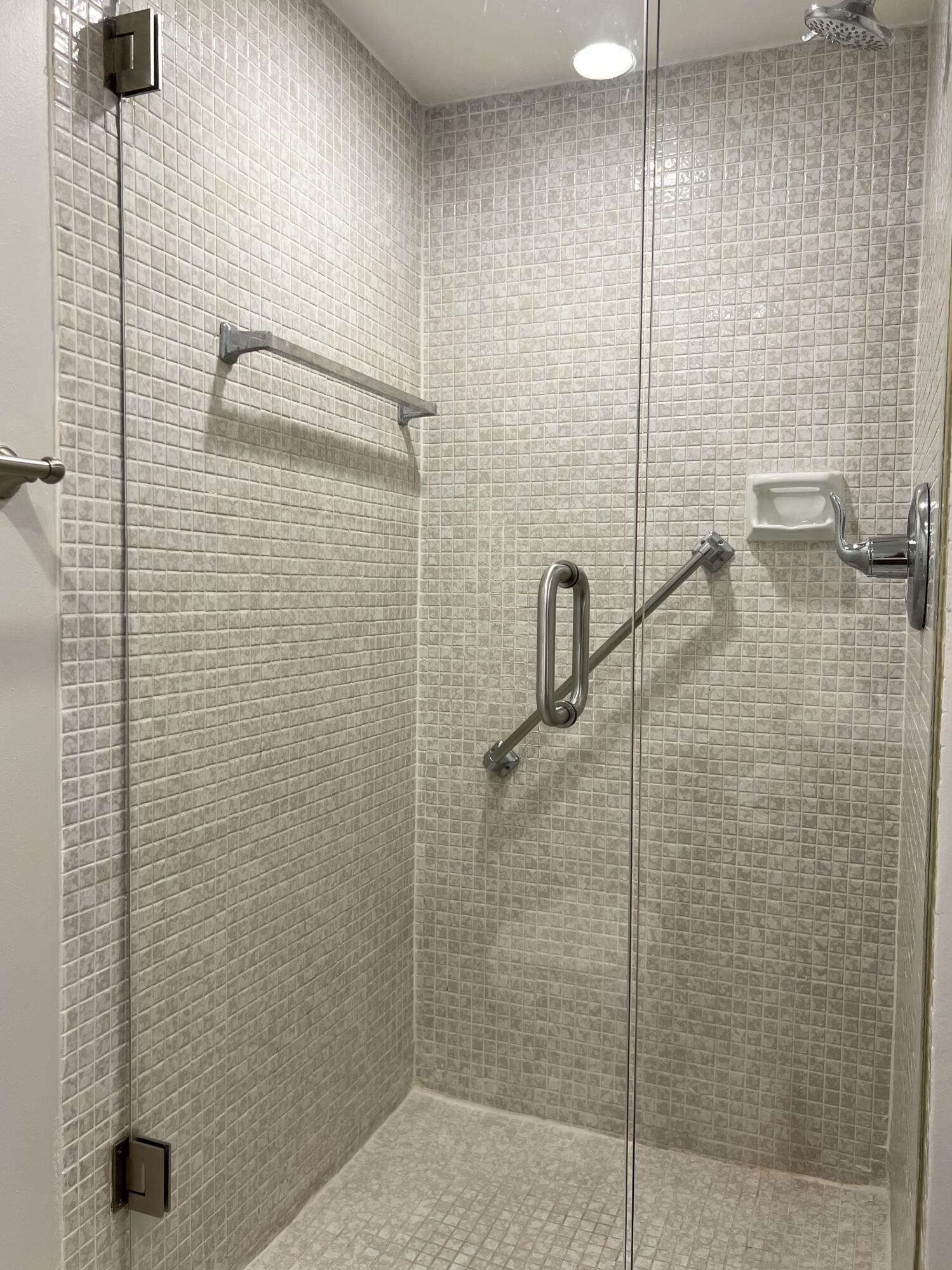 150 Burgandy Way, Unit D Delray Beach, FL 33484 - Photo 18 of 33 a bathroom with a shower