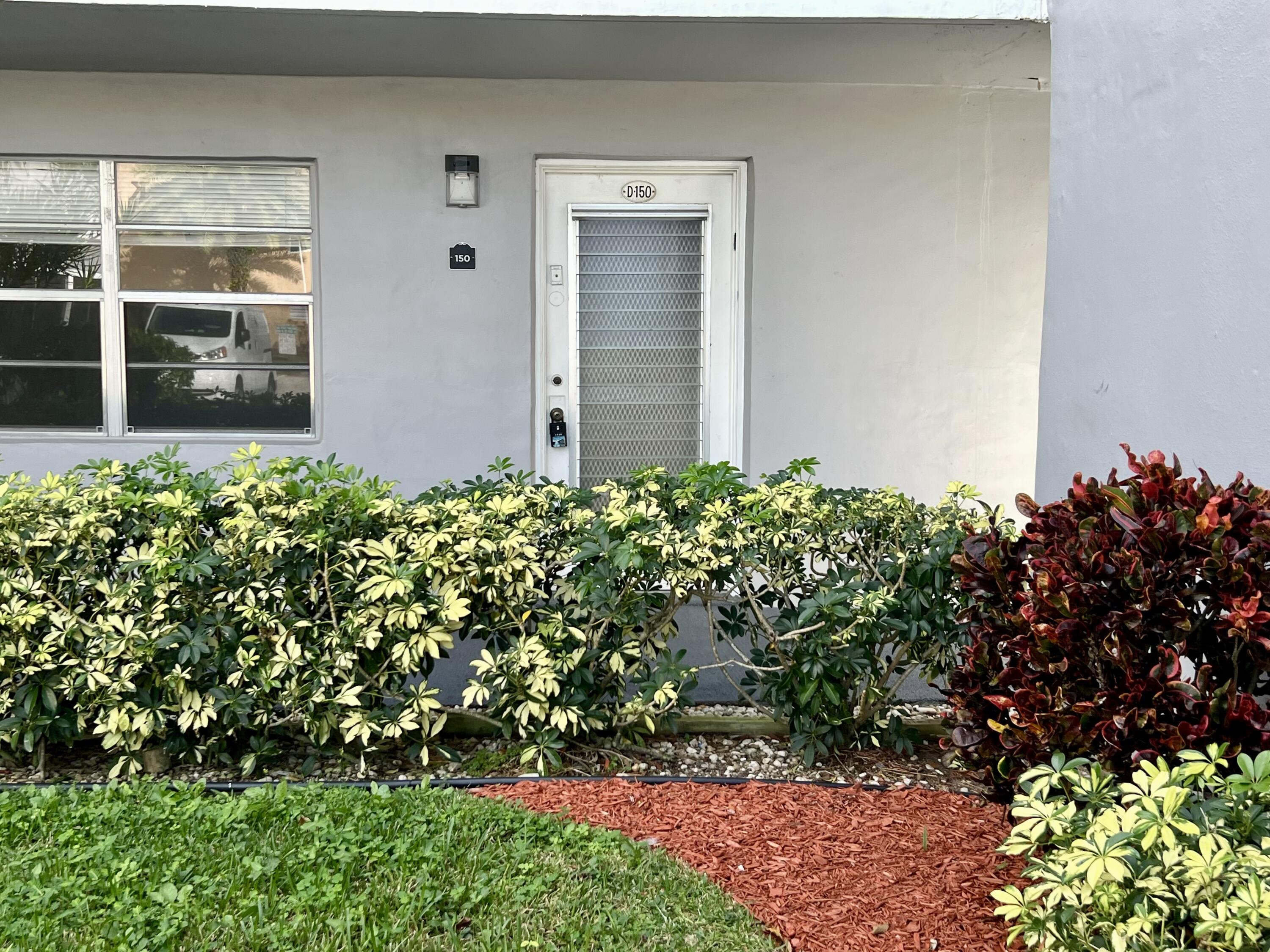 150 Burgandy Way, Unit D Delray Beach, FL 33484 - Photo 22 of 33 front view of a house