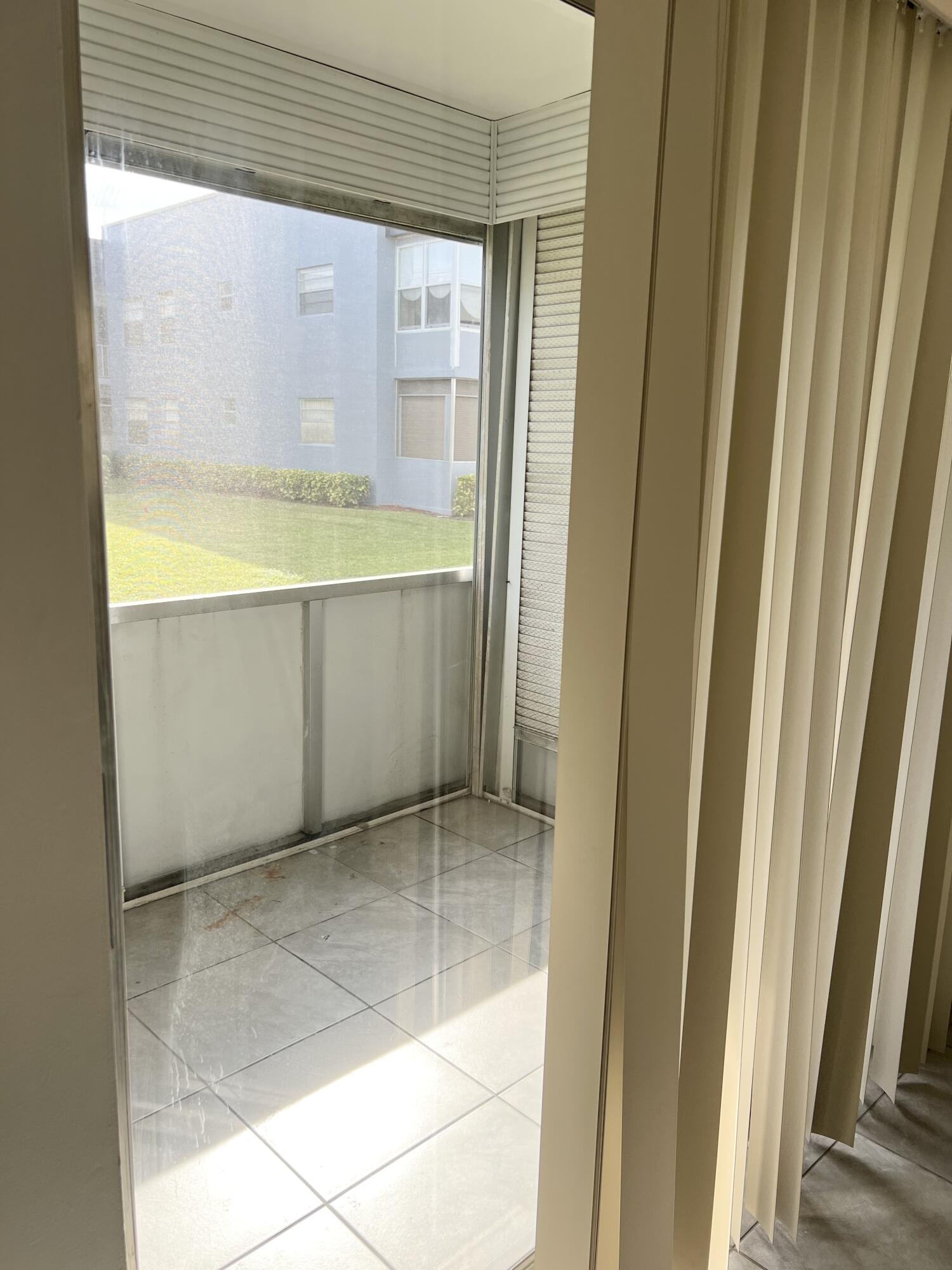 150 Burgandy Way, Unit D Delray Beach, FL 33484 - Photo 23 of 33 a view of walk in closet with window