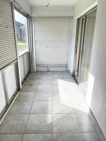 a view of a hallway to rooms