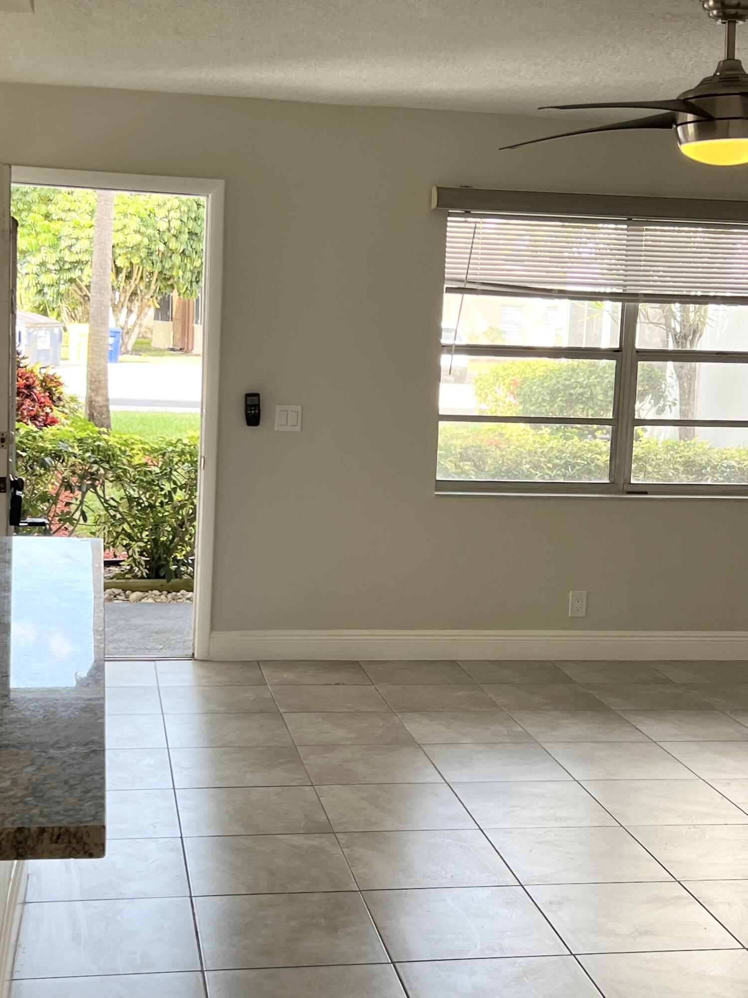 150 Burgandy Way, Unit D Delray Beach, FL 33484 - Photo 3 of 33 a view of an empty room with a window