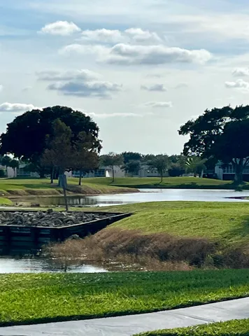 a view of a golf course with a lake