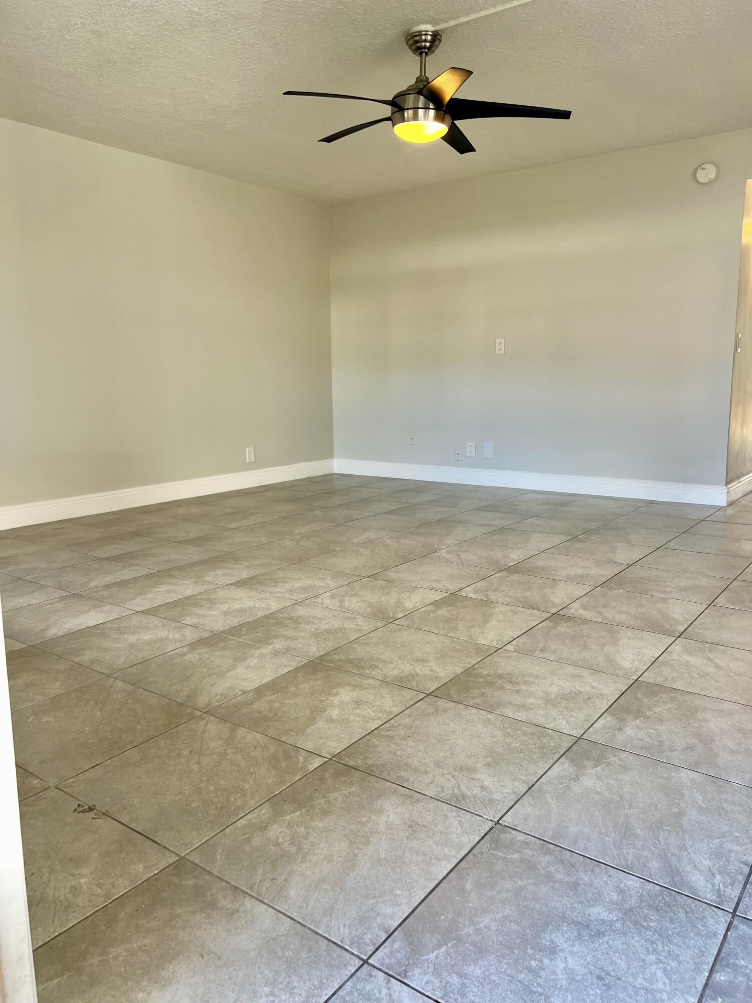 150 Burgandy Way, Unit D Delray Beach, FL 33484 - Photo 4 of 33 a view of a room with rack and racks