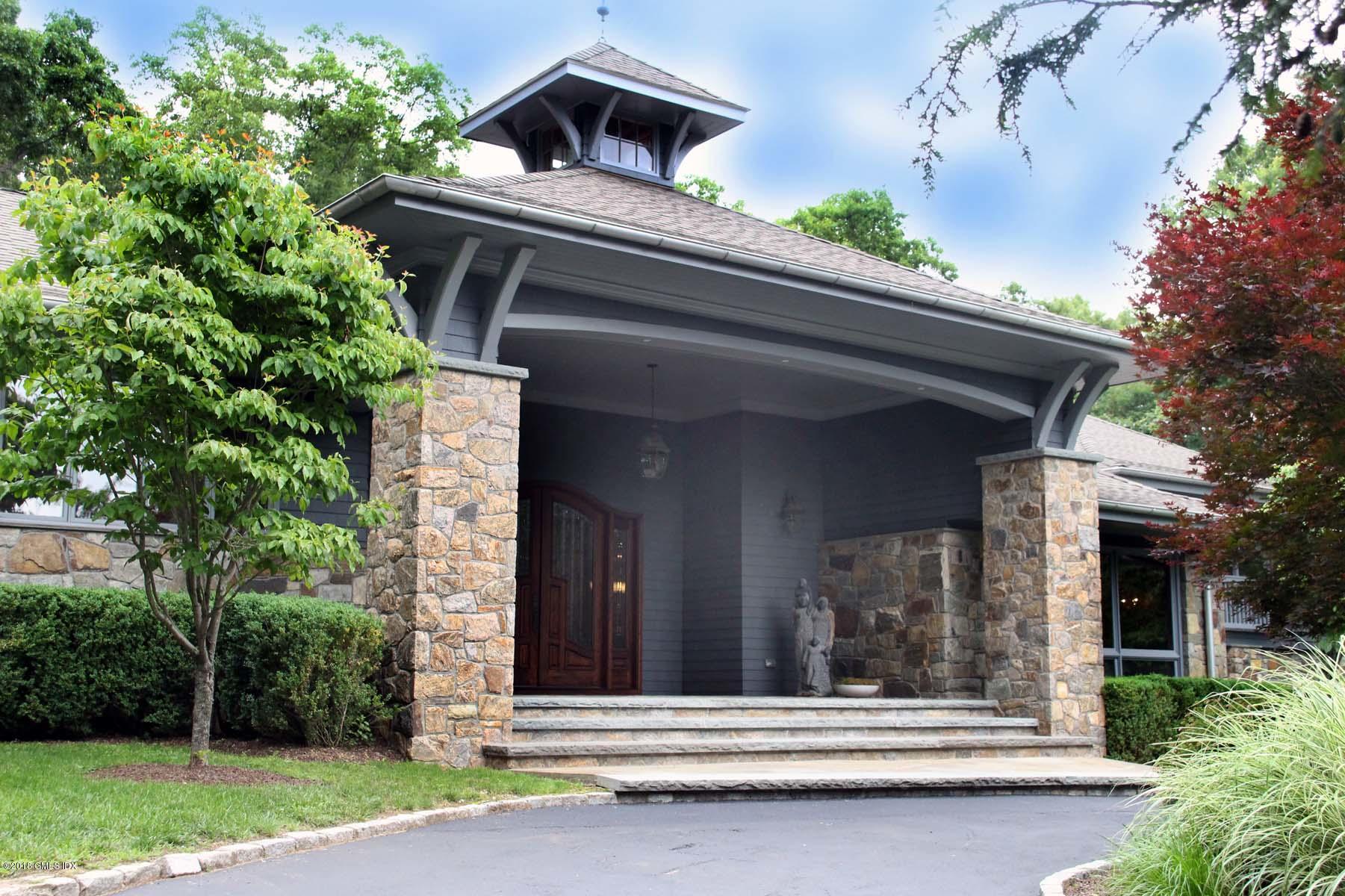 55 Cutler Road, Unit MAIN HOUSE Greenwich, CT 06831 - Photo 2 of 18 front view of house with a garden