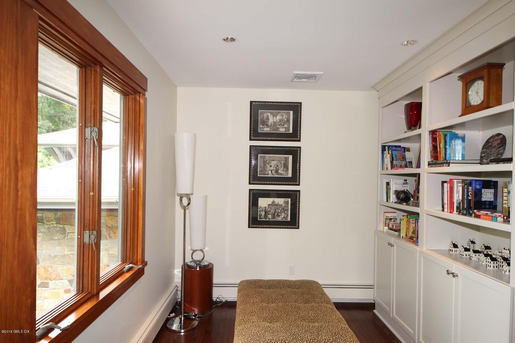 55 Cutler Road, Unit MAIN HOUSE Greenwich, CT 06831 - Photo 8 of 18 a view of a bedroom with furniture and staircase