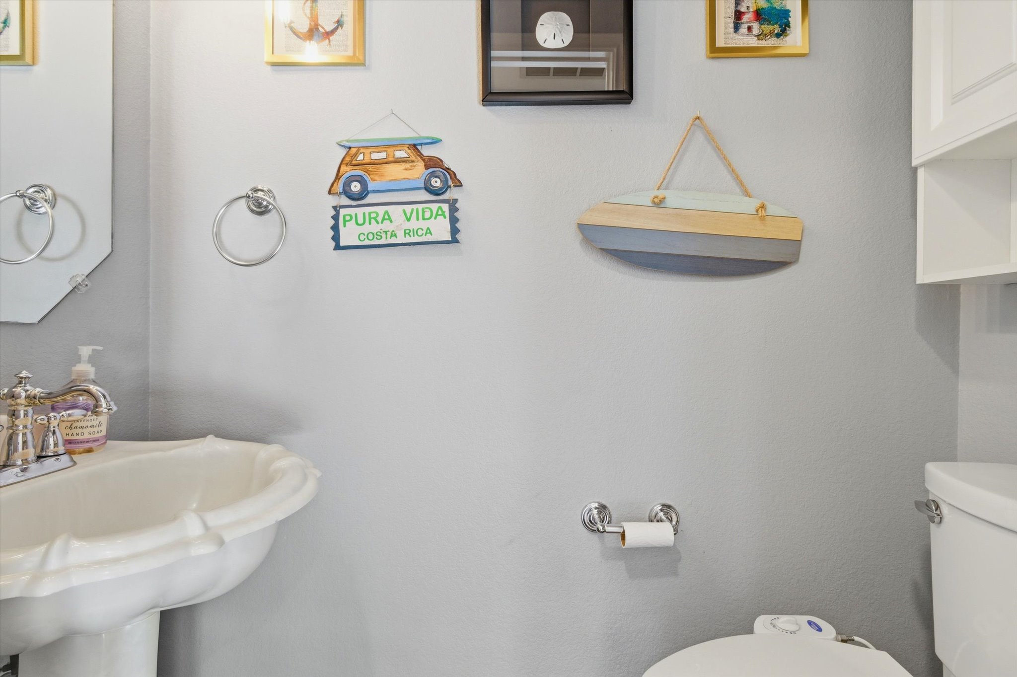 8920 West Hove Loop Austin, TX 78749 - Photo 10 of 39 Pedestal sink with an octagonal mirror and chrome towel ring