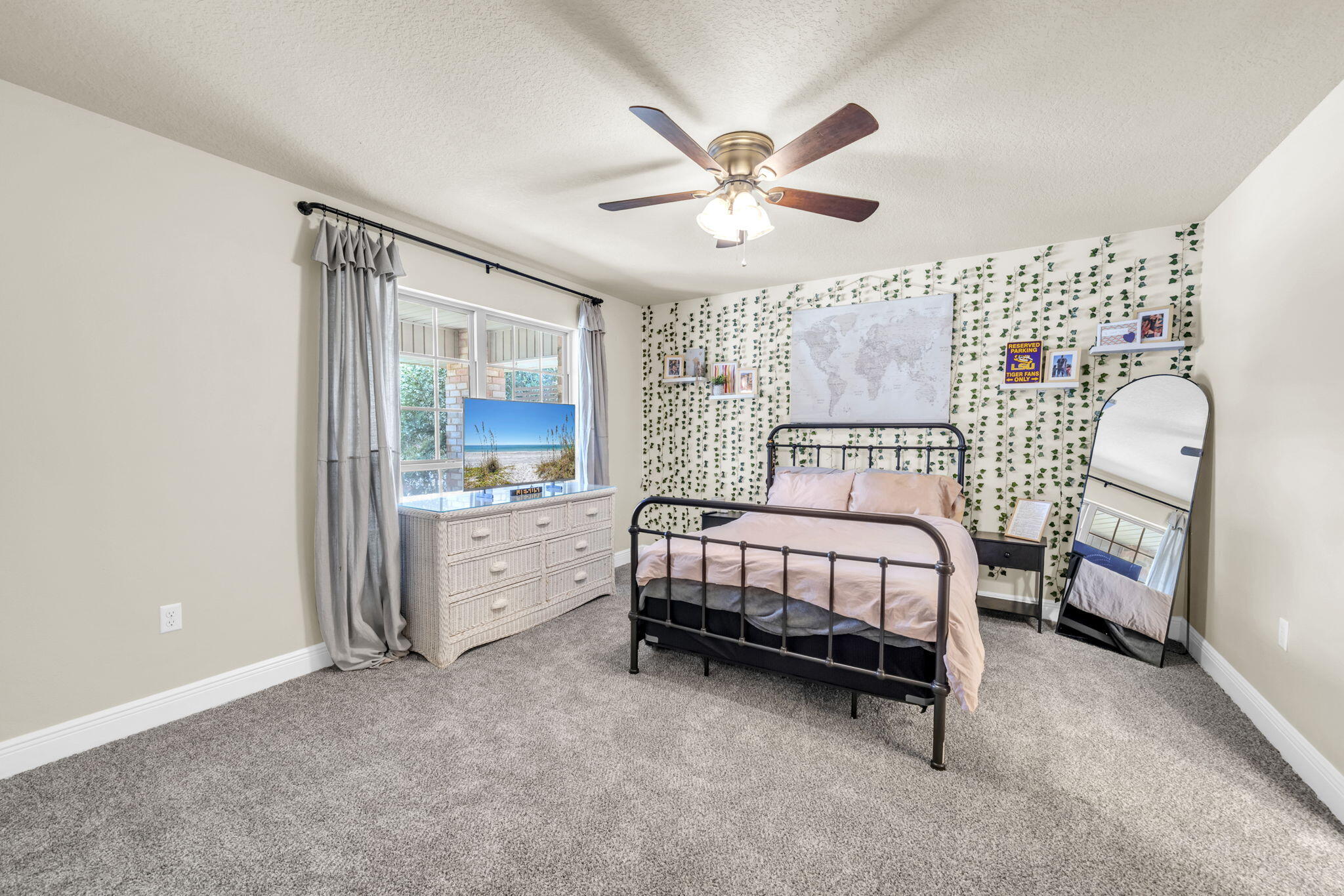 217 Raptor Drive Crestview, FL 32536 - Photo 31 of 48 a bedroom with a bed and a chandelier