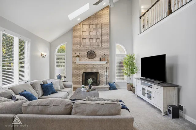 a bathroom with a toilet a sink a mirror and vanity