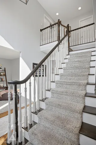 a view of a dining room with furniture wooden floor and chandelier