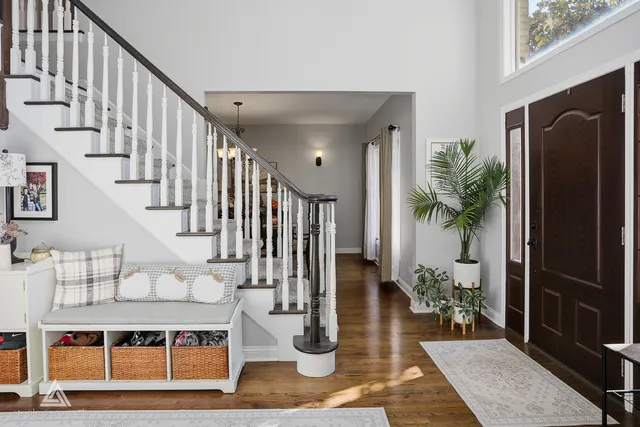 a kitchen with stainless steel appliances granite countertop a sink refrigerator and microwave