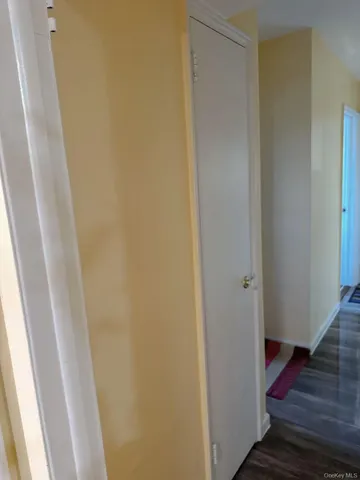 a bedroom with a bed and a mirror