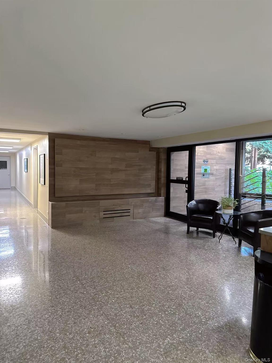 18-40 211th Street, Unit 5A Queens, NY 11360 - Photo 17 of 21 a view of livingroom with furniture and window