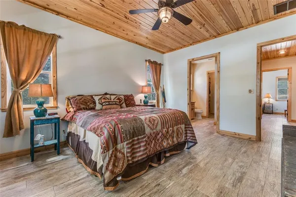 a bedroom with a bed and a mirror