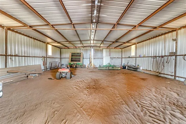 a view of a big room with wooden ceiling