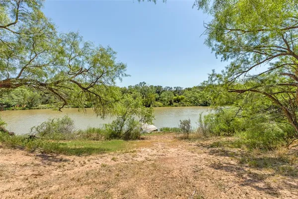 a view of a lake from a yard