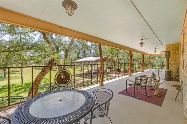 a very nice looking living room with a large window and a table