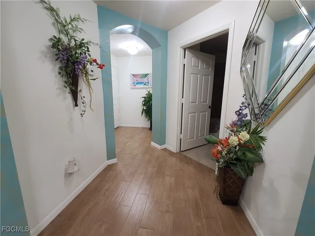 a bedroom with a bed couch and a window