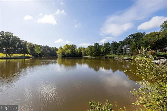 a view of a lake with houses in the back