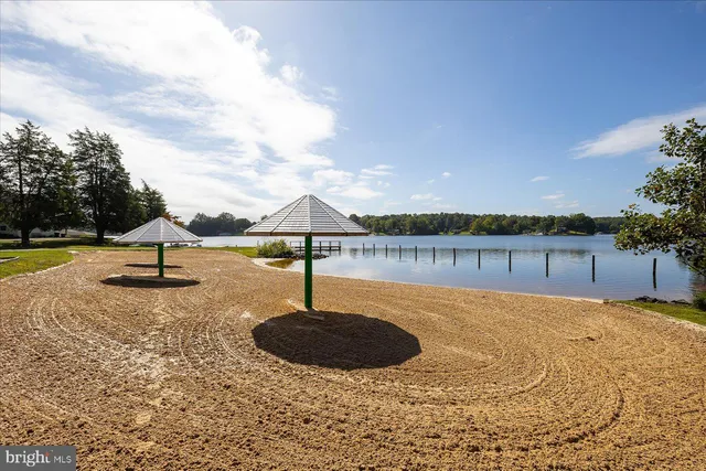 a view of a lake with houses in the back