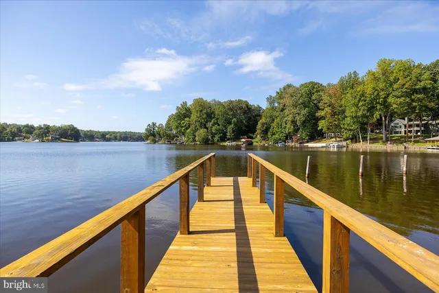 a view of a lake with houses in the background