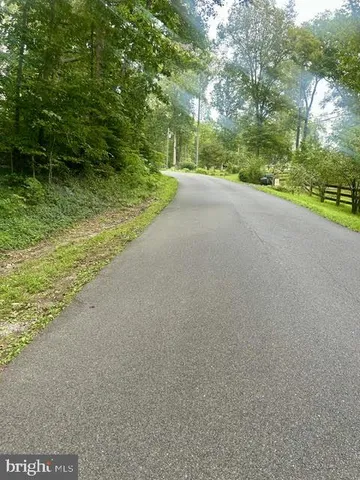 a view of a road with a yard