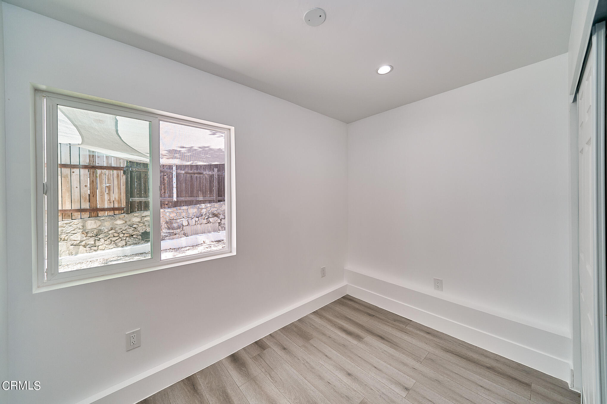 3623 A 3rd Avenue Glendale, CA 91214 - Photo 11 of 20 a view of an empty room with wooden floor and a window
