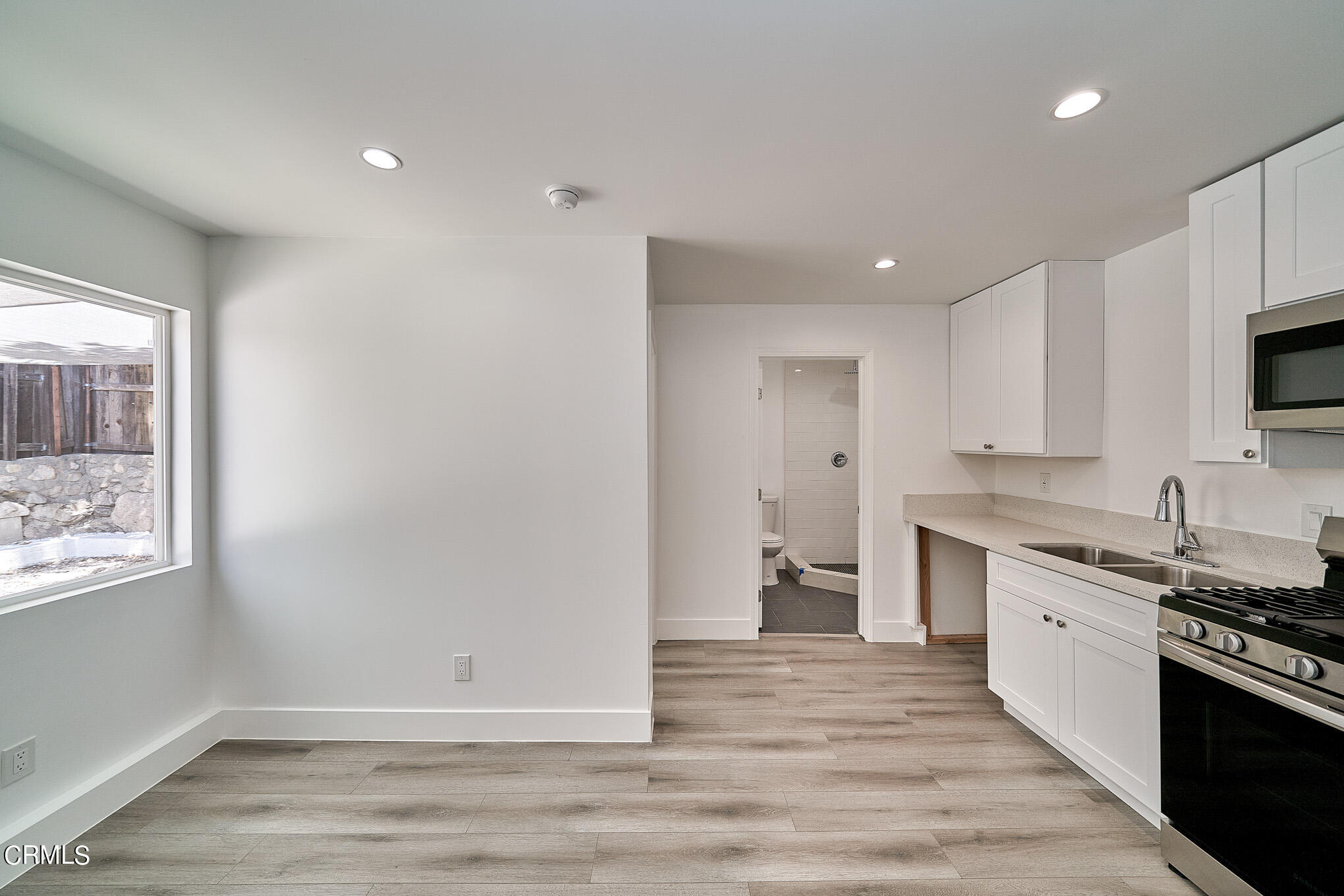 3623 A 3rd Avenue Glendale, CA 91214 - Photo 2 of 20 a view of a kitchen with a sink wooden floor and a window