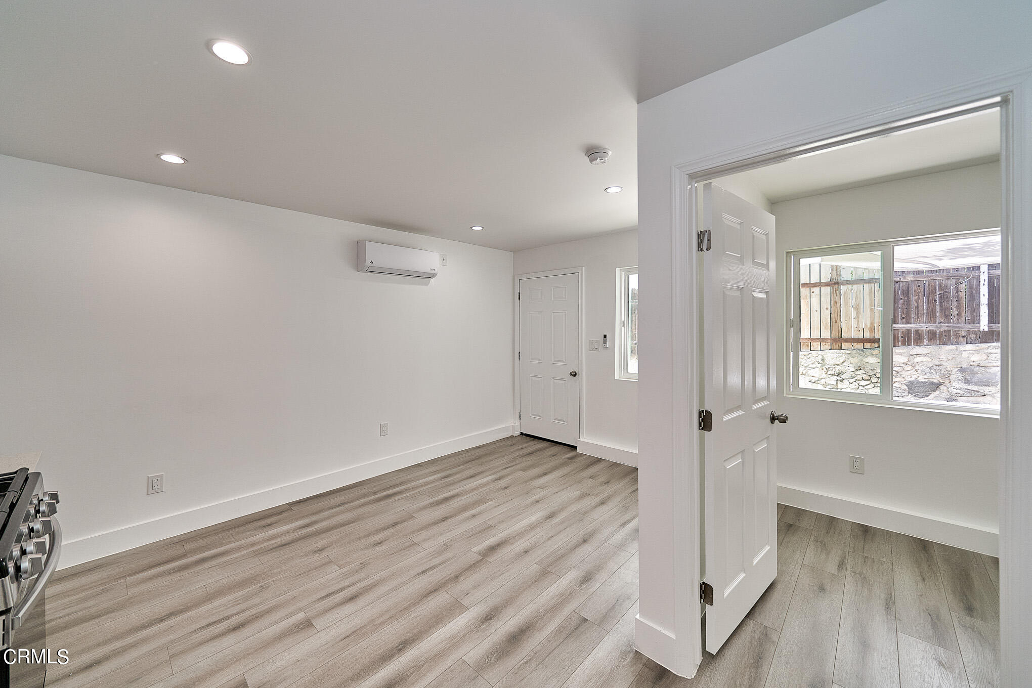 3623 A 3rd Avenue Glendale, CA 91214 - Photo 9 of 20 an empty room with wooden floor and windows