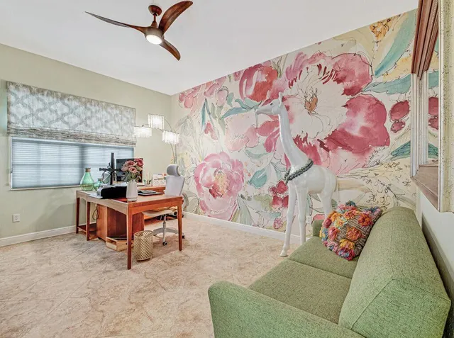 a view of hallway with window and cabinets
