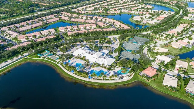 an aerial view of a houses with outdoor space and street view