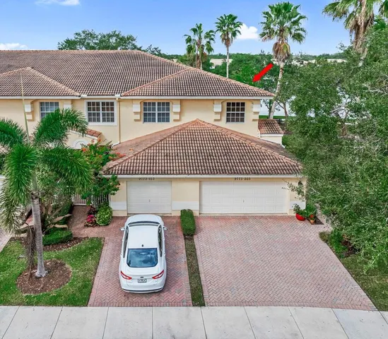 an aerial view of residential house with outdoor space and street view