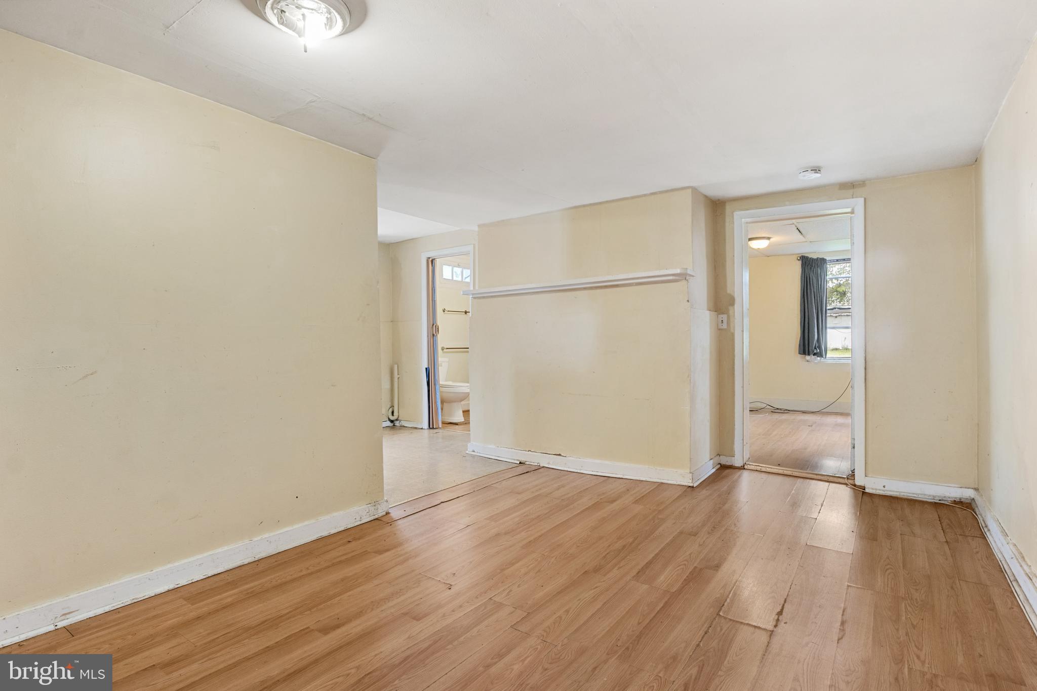 216 Main Street New Windsor, MD 21776 - Photo 5 of 16 an empty room with wooden floor