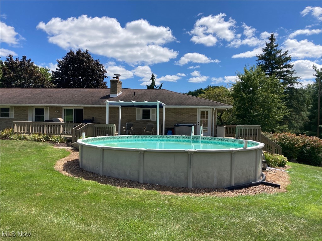 1791 Beal Road Mansfield, OH 44903 - Photo 44 of 50 Swimming pool featuring a wooden deck and a lawn