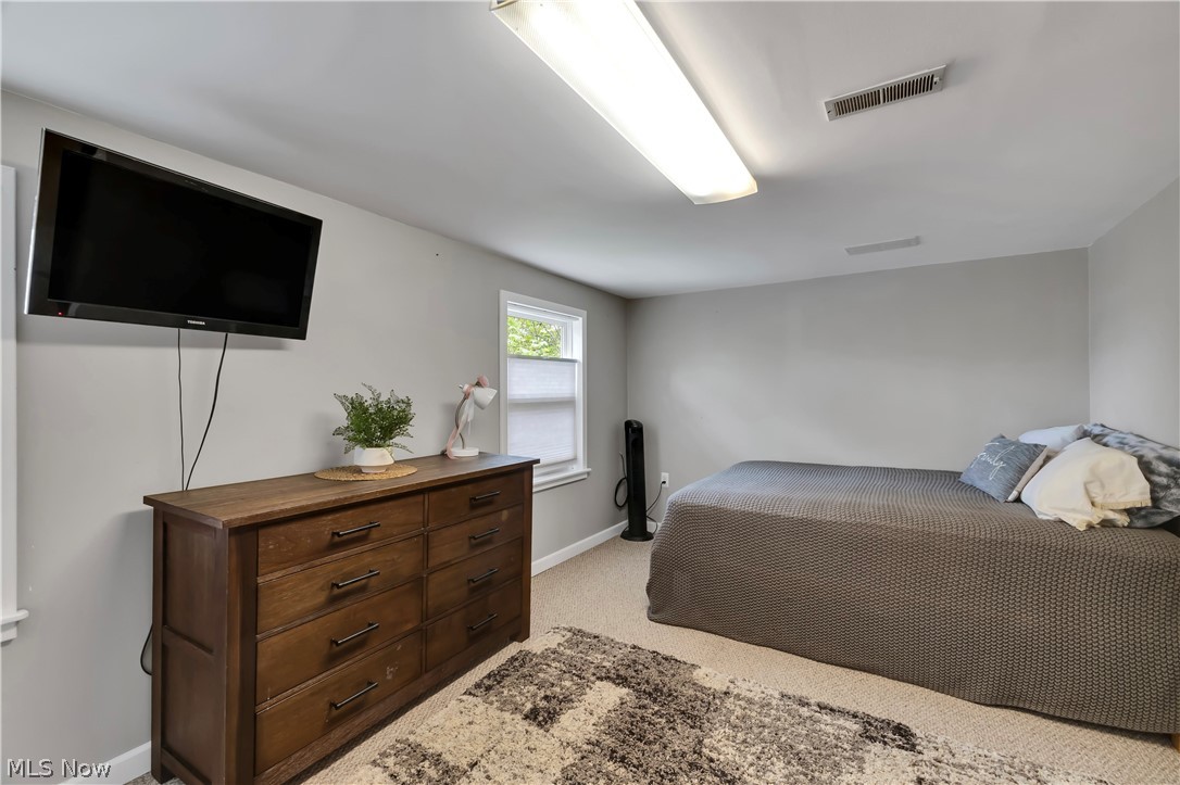 8704 Columbia Road Olmsted Falls, OH 44138 - Photo 19 of 34 Carpeted room with a bright window