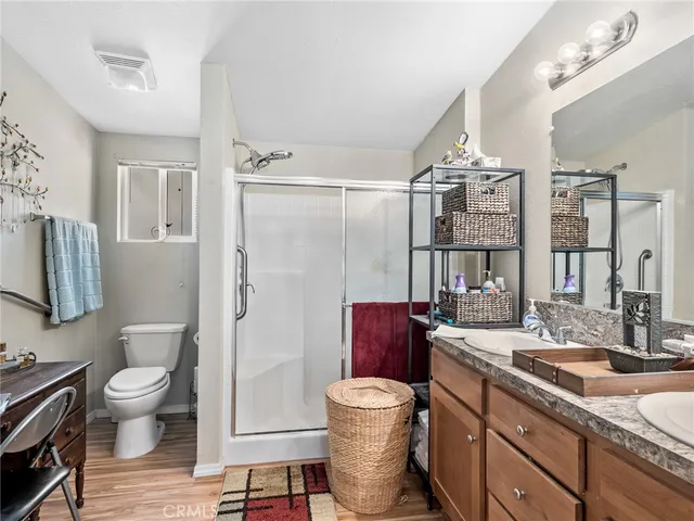 a spacious bathroom with a sink toilet and shower