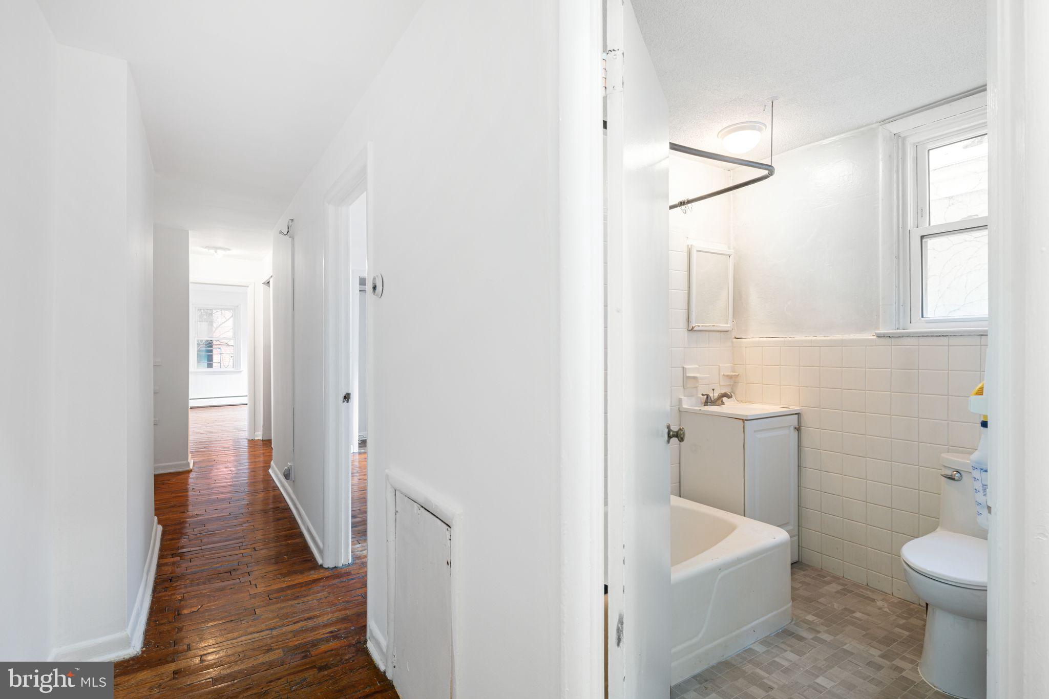 417 South 16th Street, Unit 2 Philadelphia, PA 19146 - Photo 7 of 10 a bathroom with a sink toilet and shower
