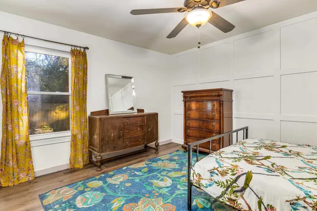 a bedroom with a bed and a dresser