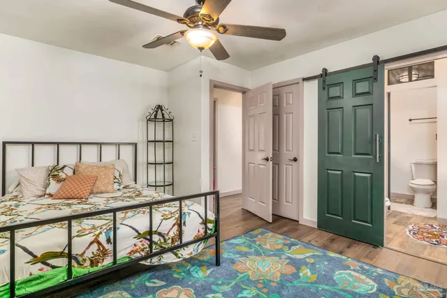 a bedroom with furniture and a window