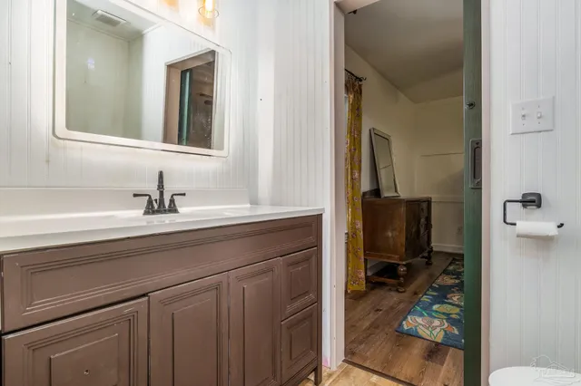 a en suite bathroom with a sink a mirror and a toilet