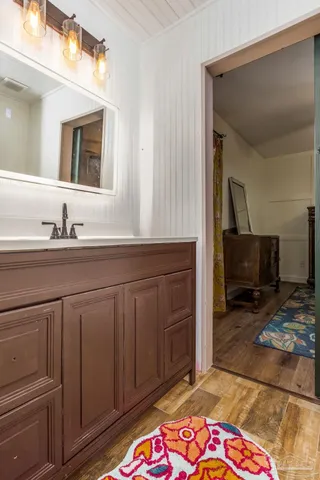 a bathroom with a sink and a mirror