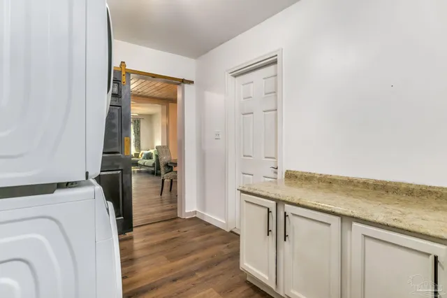 a view of a bathroom with a sink and a washer