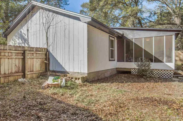 a backyard of a house with lots of green space
